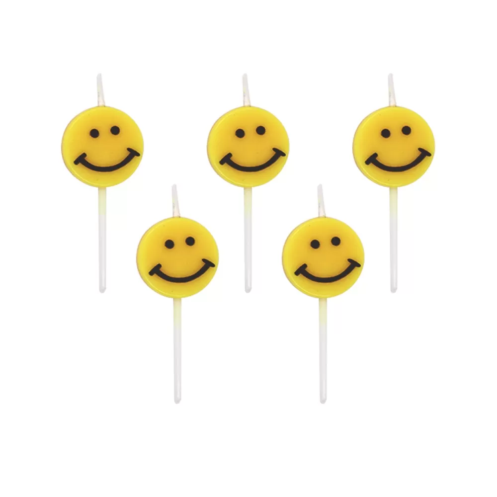 Yellow smiley face cartoons decorate birthday candles