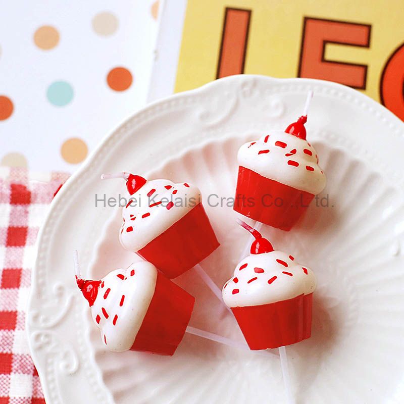 Red cupcakes decorate birthday candles