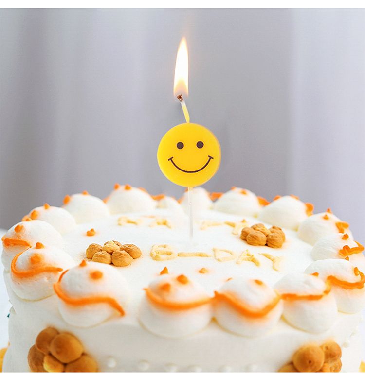 Yellow smiley birthday cartoon candle