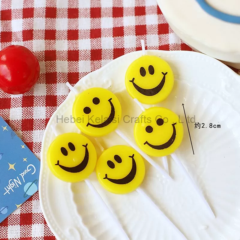 Yellow smiley birthday cartoon candle