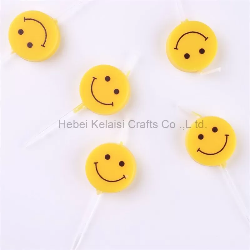 Yellow smiley birthday cartoon candle