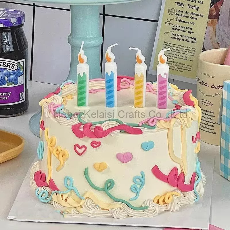 Birthday cartoon cake candle that mimics birthday thread candles