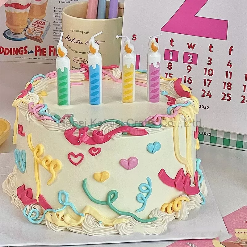 Birthday cartoon cake candle that mimics birthday thread candles